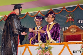 The Governor of Arunachal Pradesh, Shri JP Rajkhowa, awarding the Doctorate Degree to a candidate in the 13th University Convocation of Rajiv Gandhi University (RGU), Rono Hills, Doimukh in the University campus on 30th November 2015. 